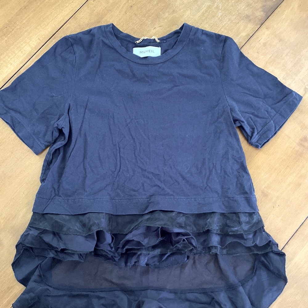 The brand is Muveil. It is navy with layered ruffles on the bottom. A Medium